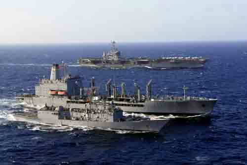 USNS Guadalupe (T-AO 200) conducts a replenishment at sea with USS Curts (FFG 38) and USS John C. Stennis (CVN 74).